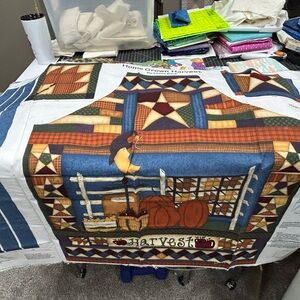 Harvest Themed Quilted Fabric Panel, other vintage fabrics and a sewing caddy.